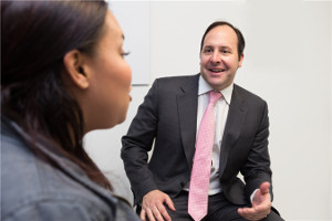 Dr. Zuckerman speaks with a cosmetic surgery patient.